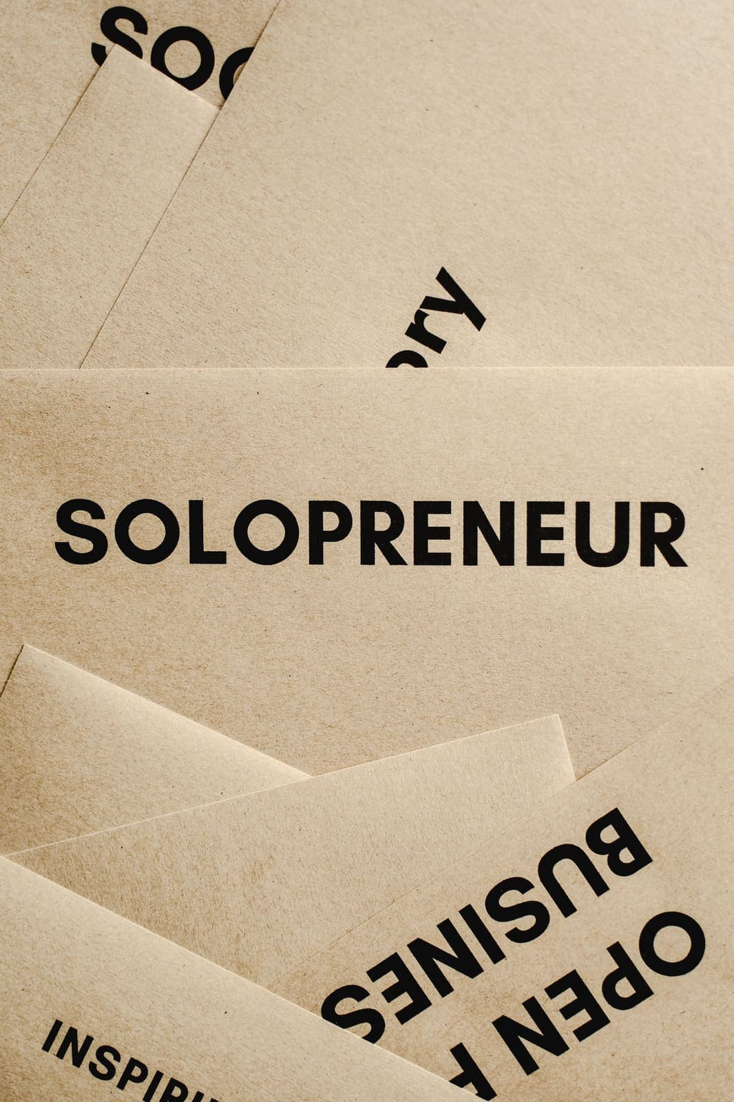 Solopreneur kraft paper cards representing independent business building